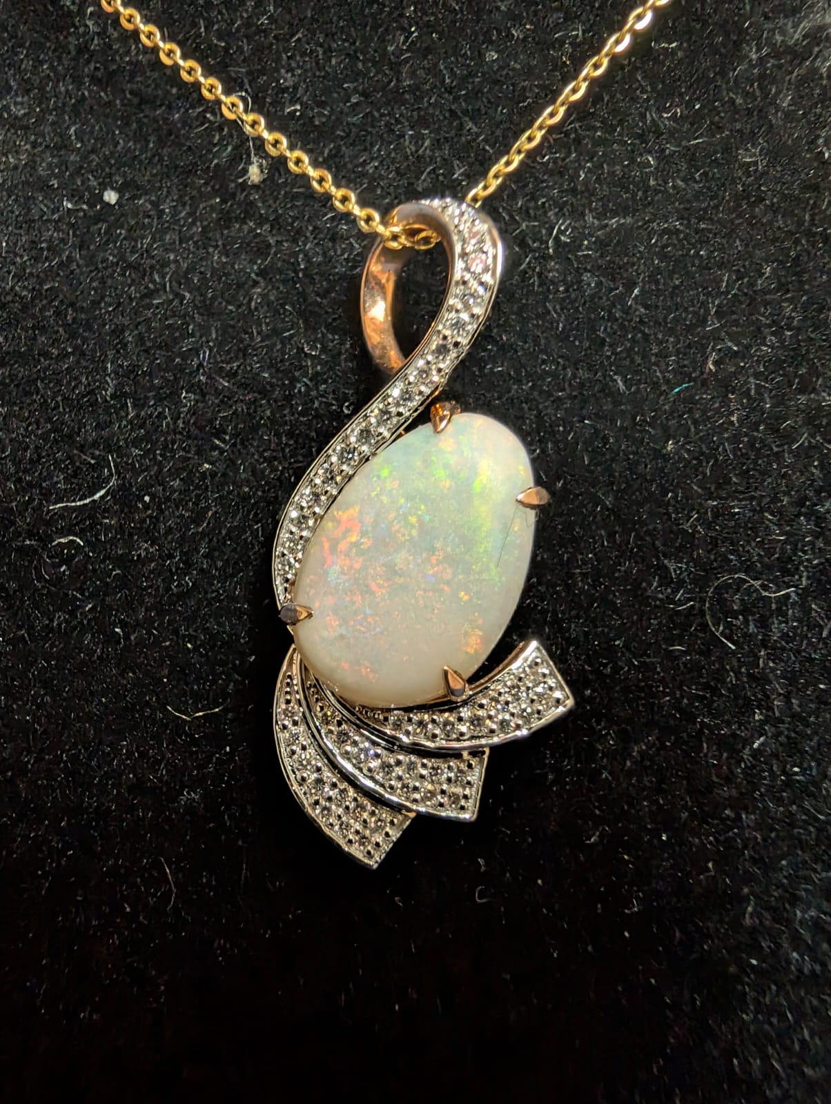 Elegant White Opal Pendent set in 14kt Gold